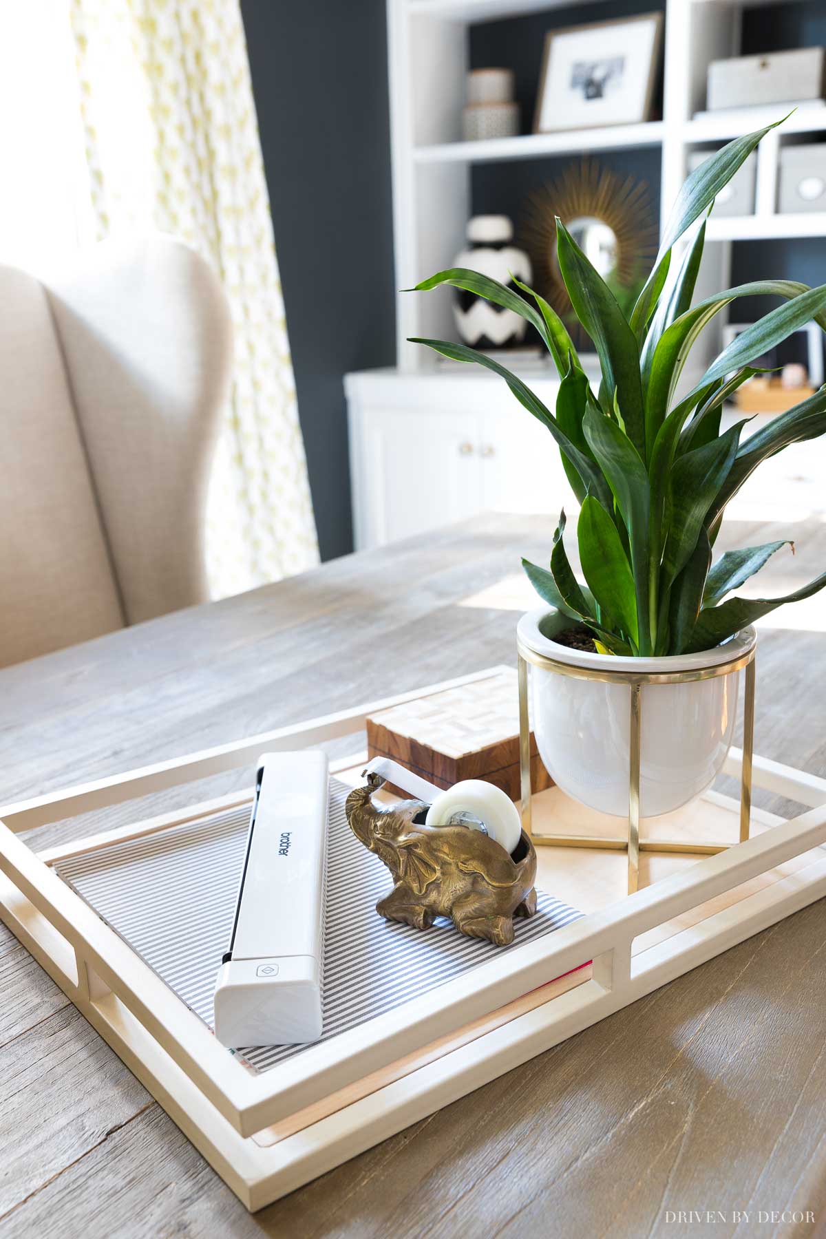 An easy desk organization idea is to have a tray to corral your calendar, paperwork, and most used desk supplies