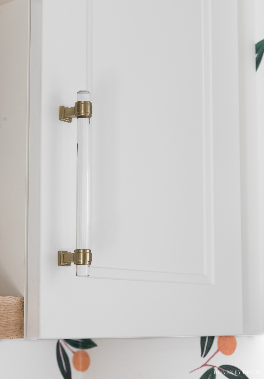 LOVE these acrylic cabinet pulls that totally dress up my Ikea laundry room cabinets!