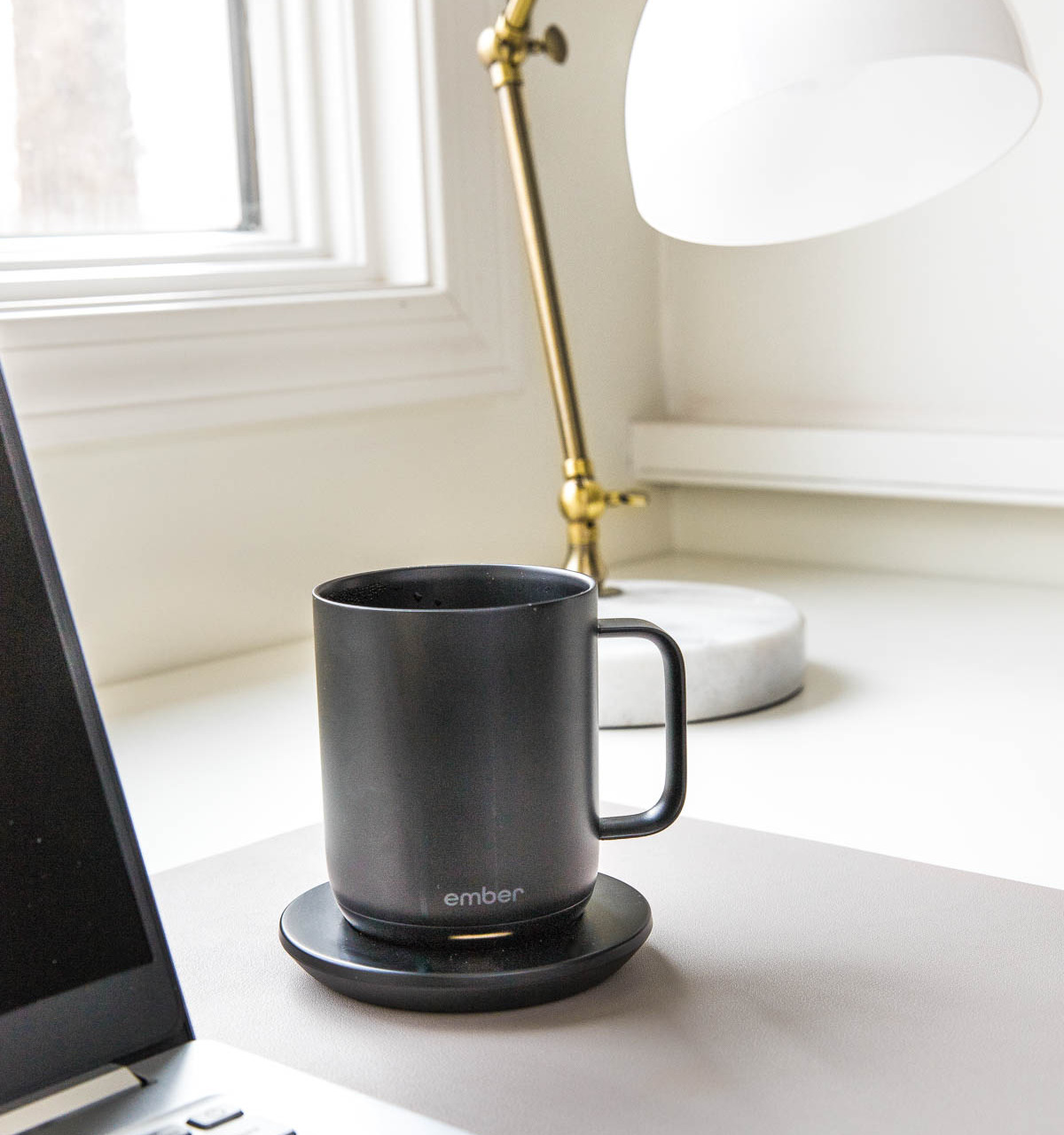 One of my favorite Amazon gadgets - a smart mug that keeps your coffee hot on AND off the heating plate!