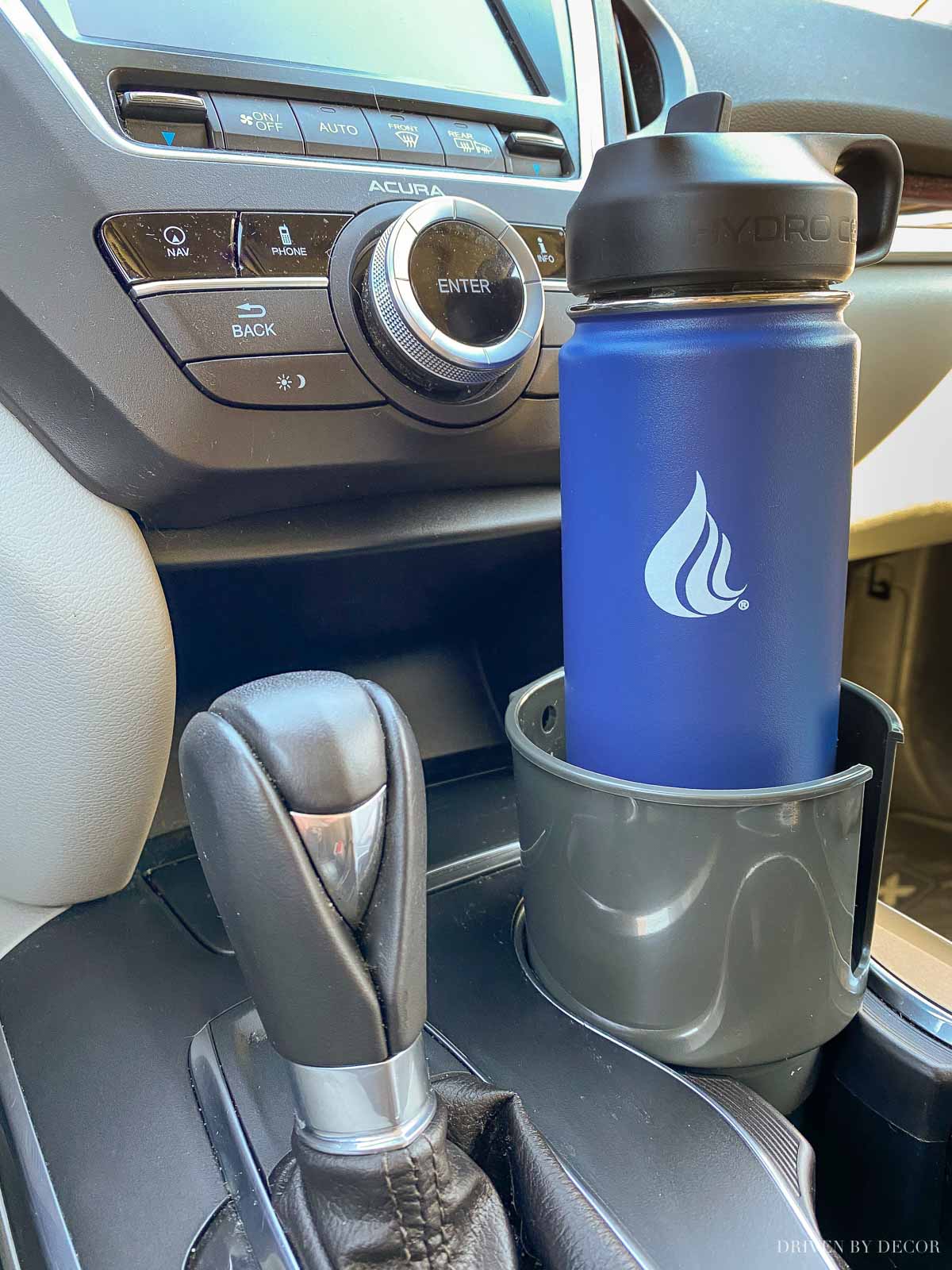 Love this car cup holder that fits large water bottles and mugs with handles too!