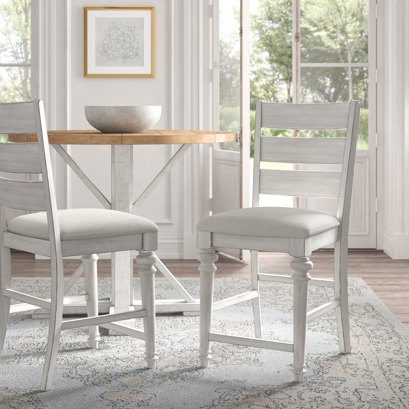 Gorgeous wood counter stools with an antique white finish - love the design of the legs!
