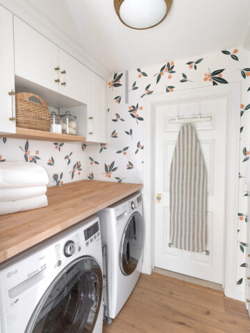 Our Ikea laundry room! I share all of the details of our Ikea cabinets, wood countertop, wardrobes, & more in this post!