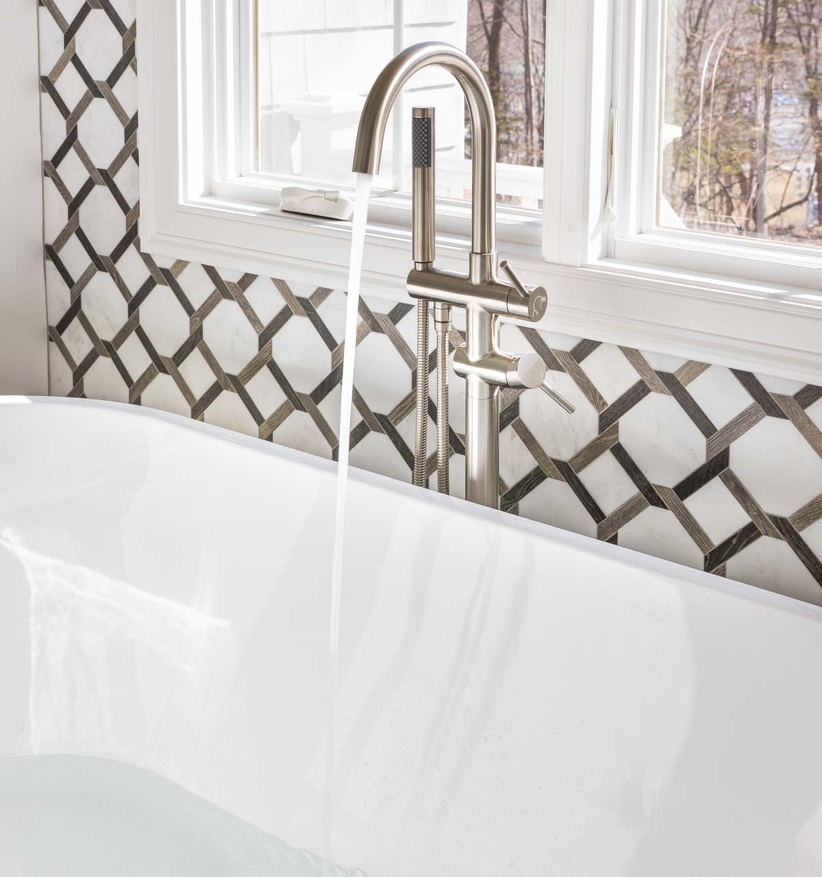 Filling the bathtub with hot water as the first step in laundry stripping!