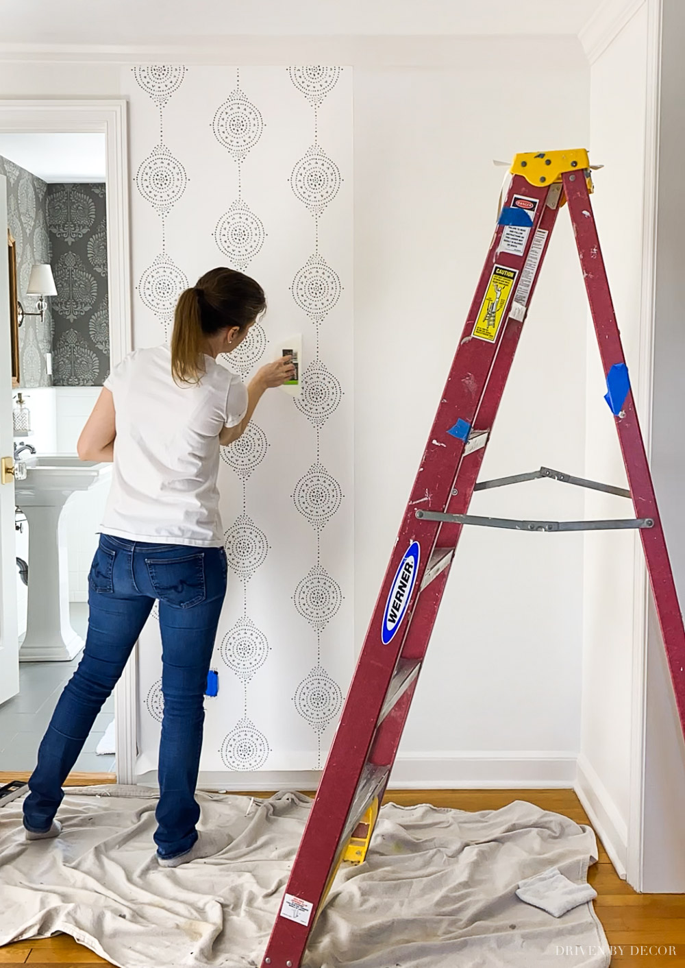 Entryway makeover starting with hanging new wallpaper!