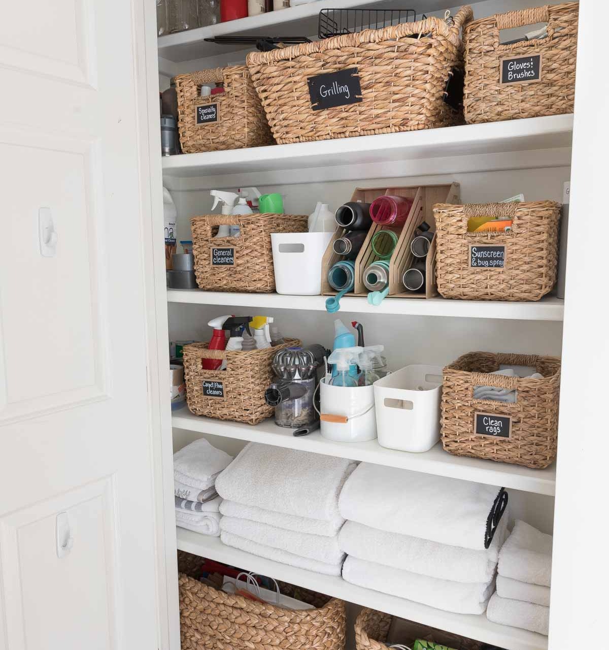 Our closet of cleaning supplies, including the microfiber cloths I use for cleaning our marble bathroom