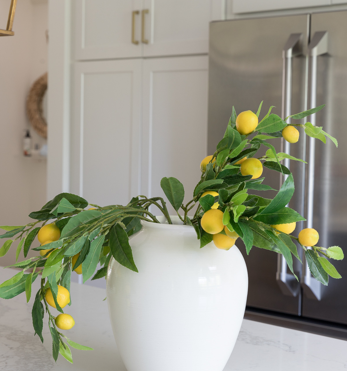 The key to making artificial flowers and branches look real is to fluff them up! Click to see the after!
