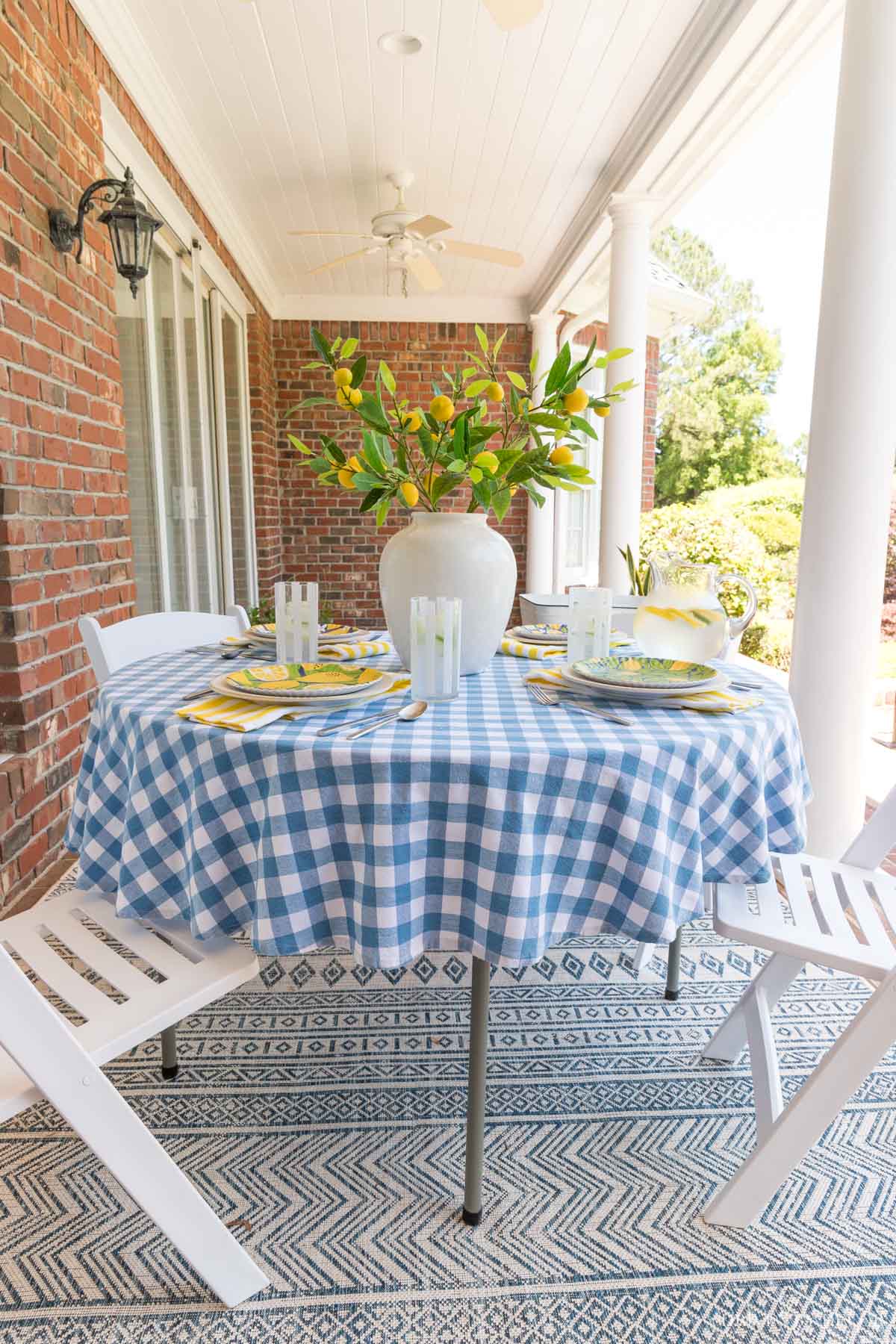 Create a stylish outdoor dining space with a simple folding table and chairs!