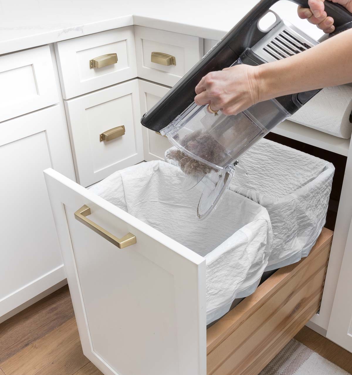 Shark vs. Dyson cordless vacuums - dustbin size and how they empty