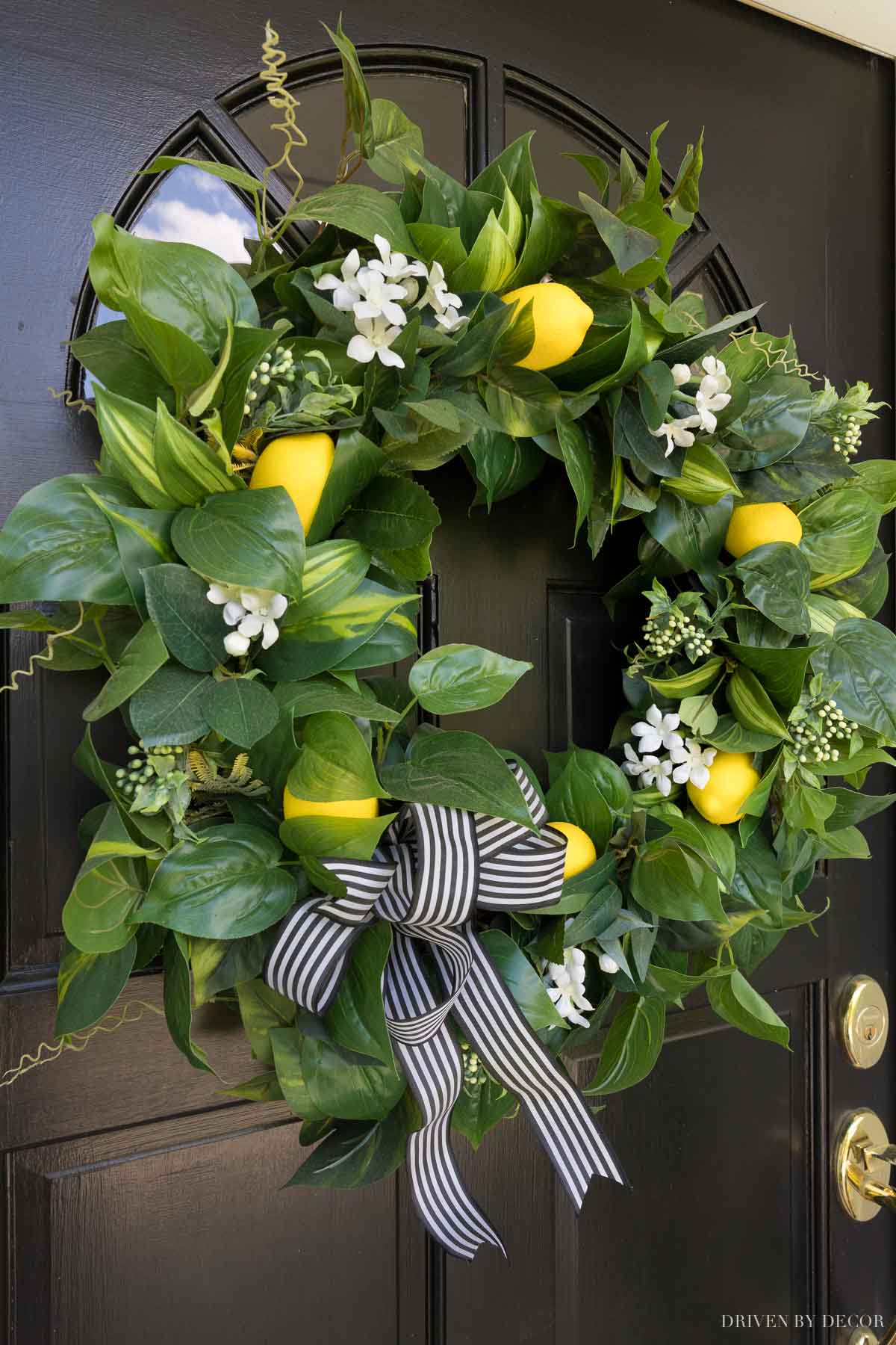 Our spring wreath with artificial greenery, flowers, and lemons!