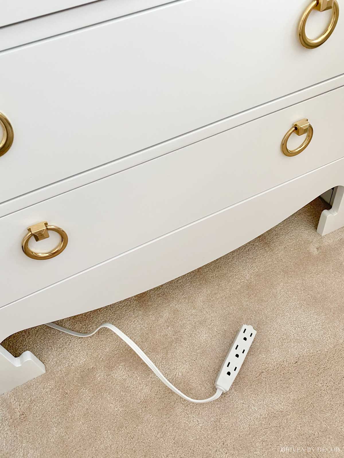 A simple solution for easy access to an outlet behind a piece of furniture!