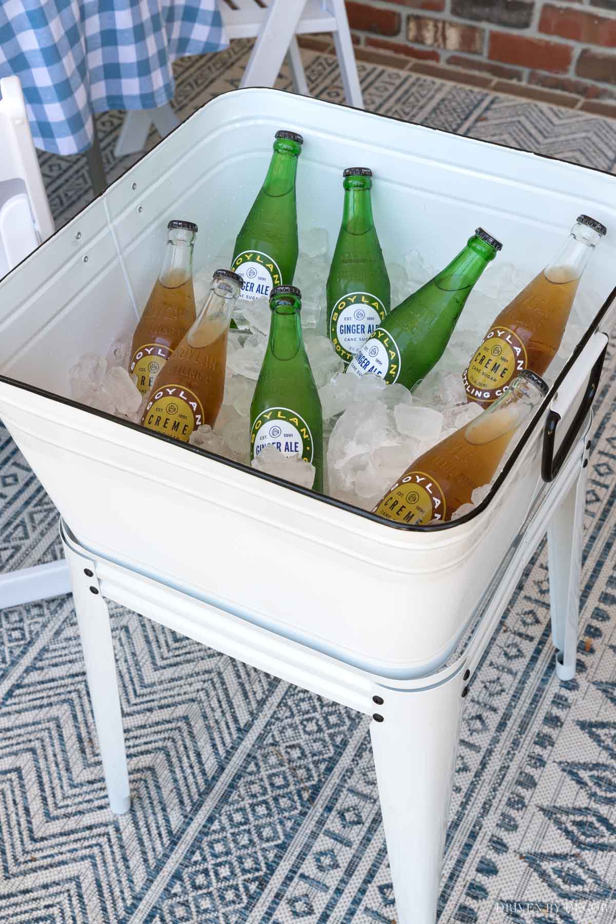LOVE this elevated planter she uses as a drink cooler!