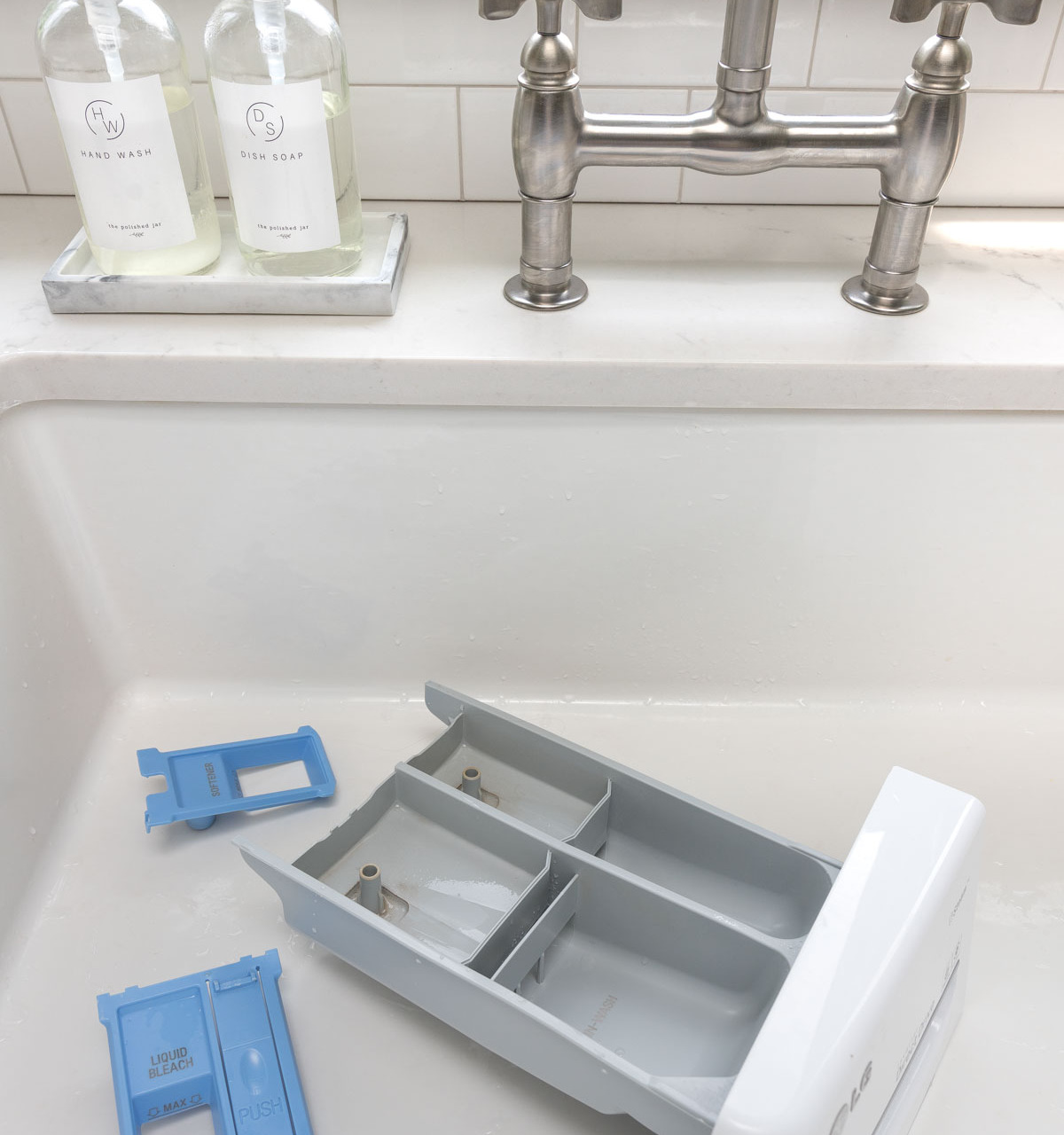 Tips for cleaning your washing machine including the detergent dispenser
