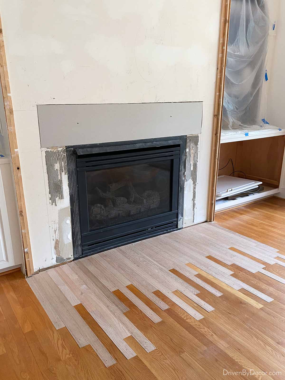 Removing hearth and adding hardwoods prior to refinishing our floors