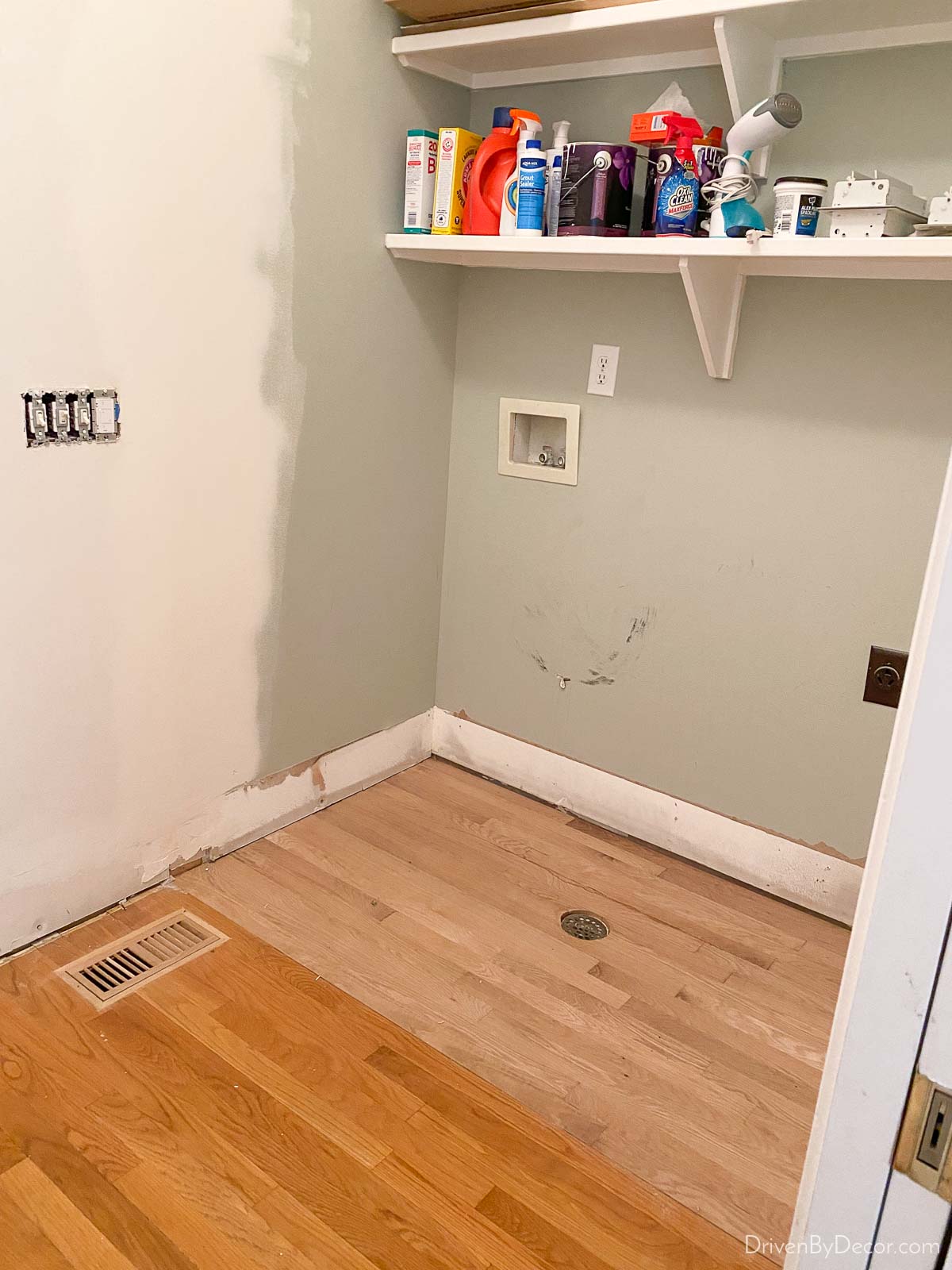 Patching the hardwood floors in our laundry room before refinishing them