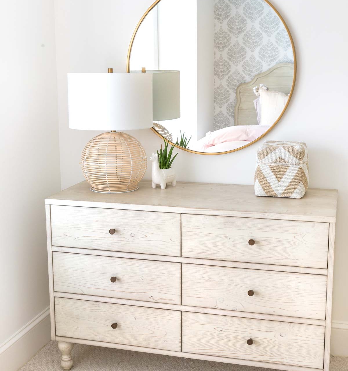 Round mirror over dresser