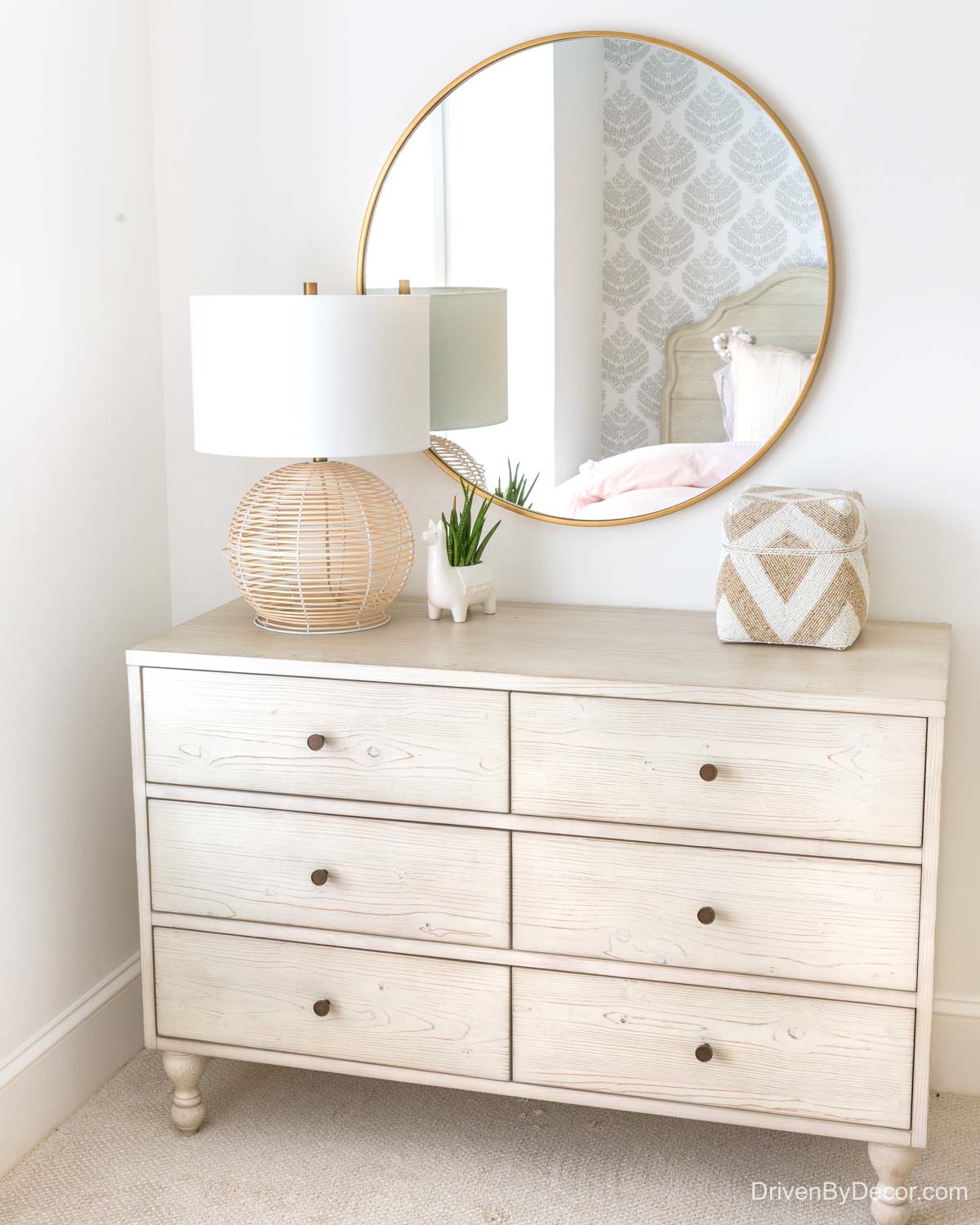 Round mirror over dresser