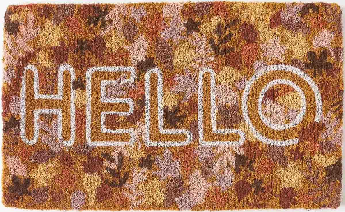 Hello doormat with a background of fall leaves