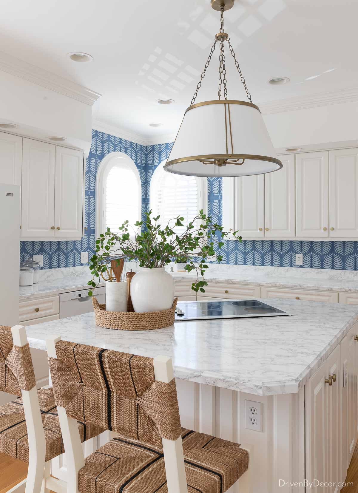 Blue wallpaper on a kitchen backsplash - one of my favorite wallpaper ideas!