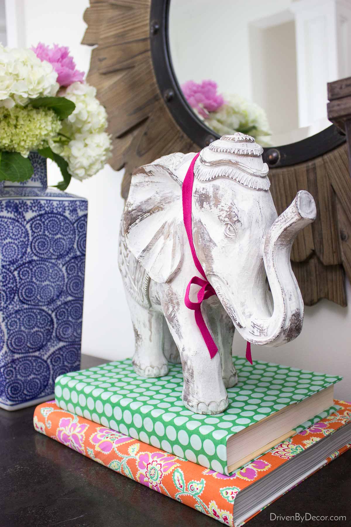 Wrap books with colorful wallpaper or fabrics to decorate seasonally - love this idea!