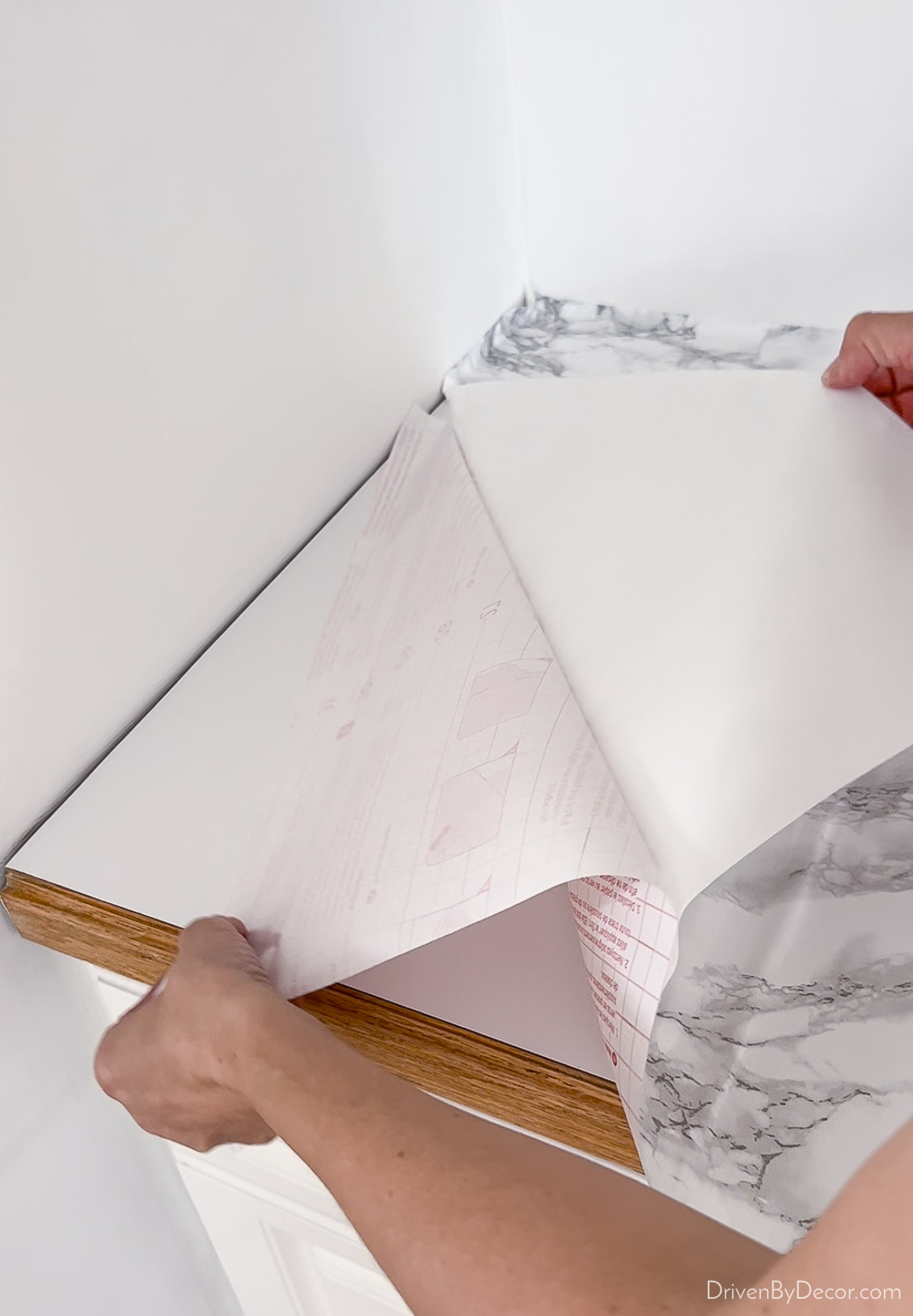Remove backing from contact paper and adhere to your countertops