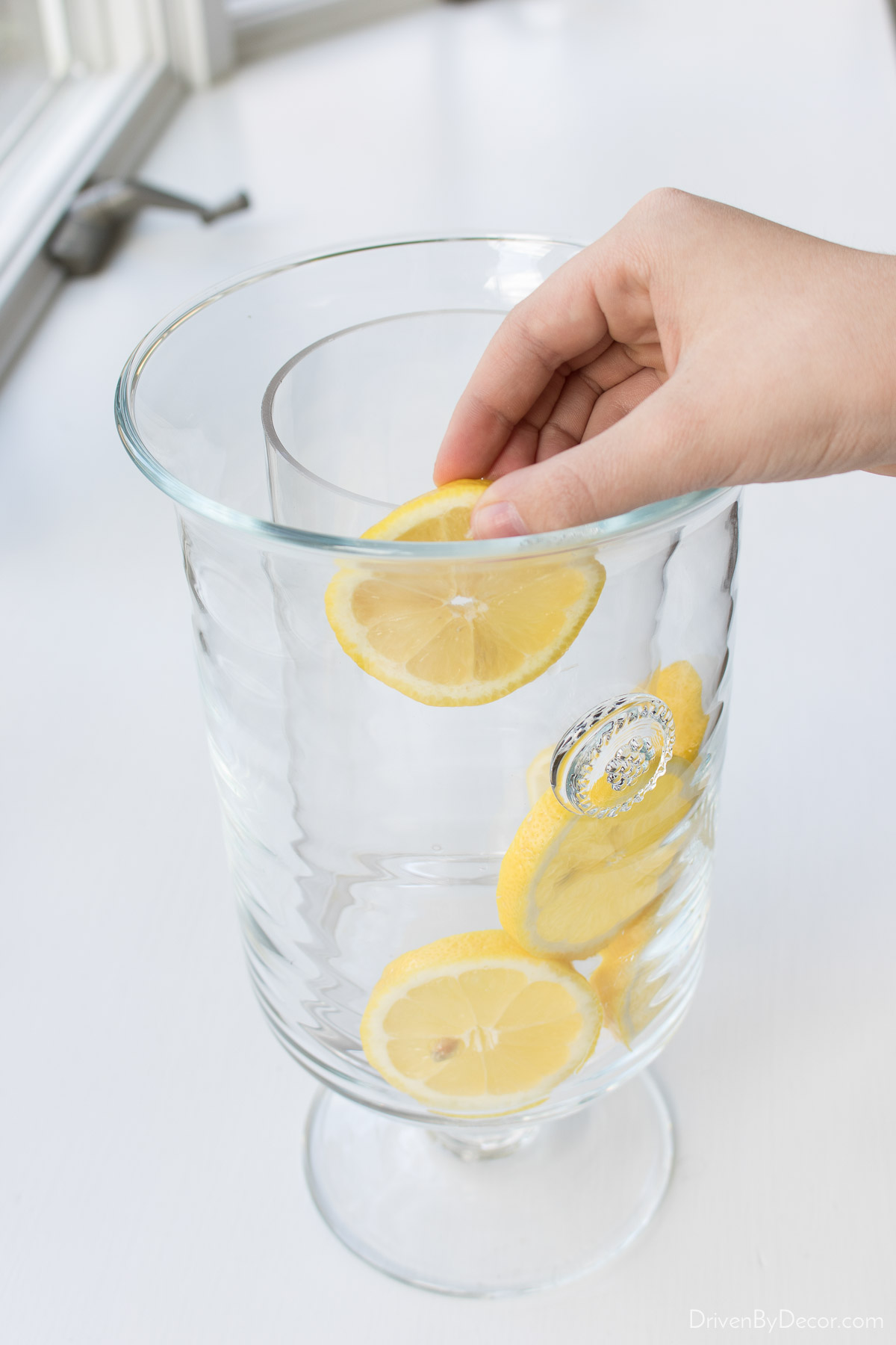 Add lemons in the space between to vases for a lemon lined floral arrangement!