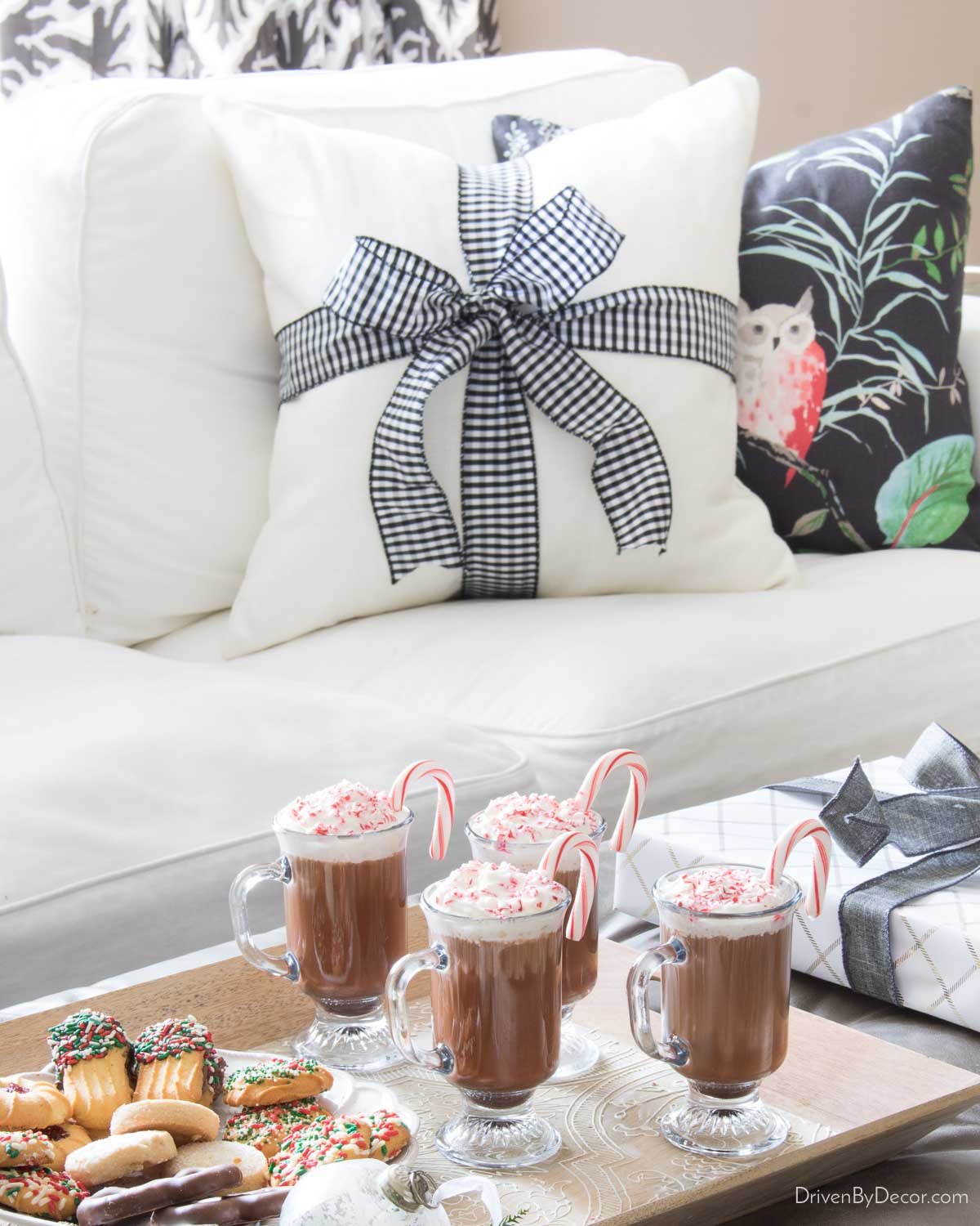 Pillow wrapped with ribbon and tied in a bow for simple Christmas decorations