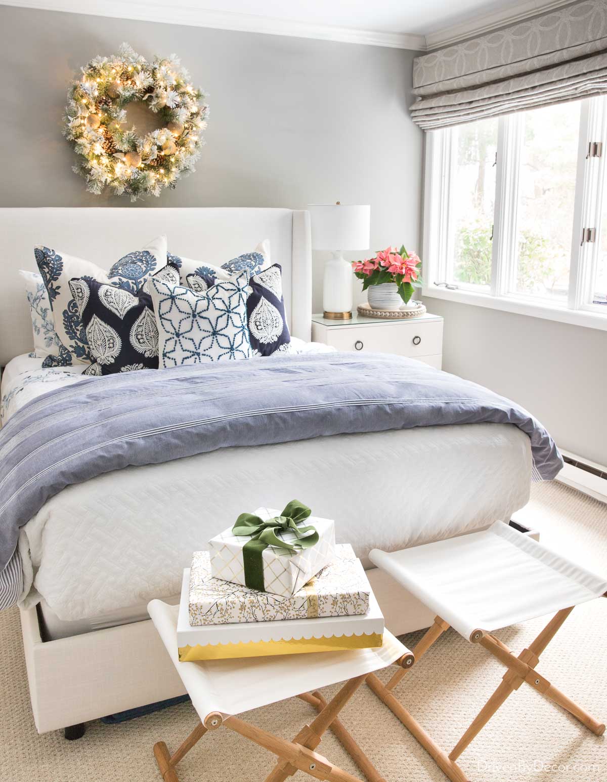 A lighted wreath above our guest bed is the perfect simple Christmas decoration