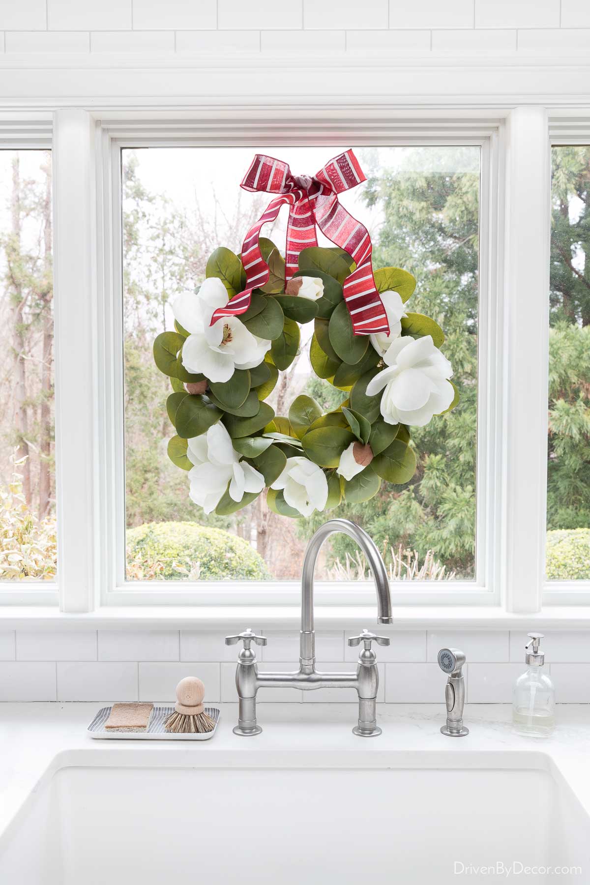 I love this simple wreath hung on a window over the kitchen sink