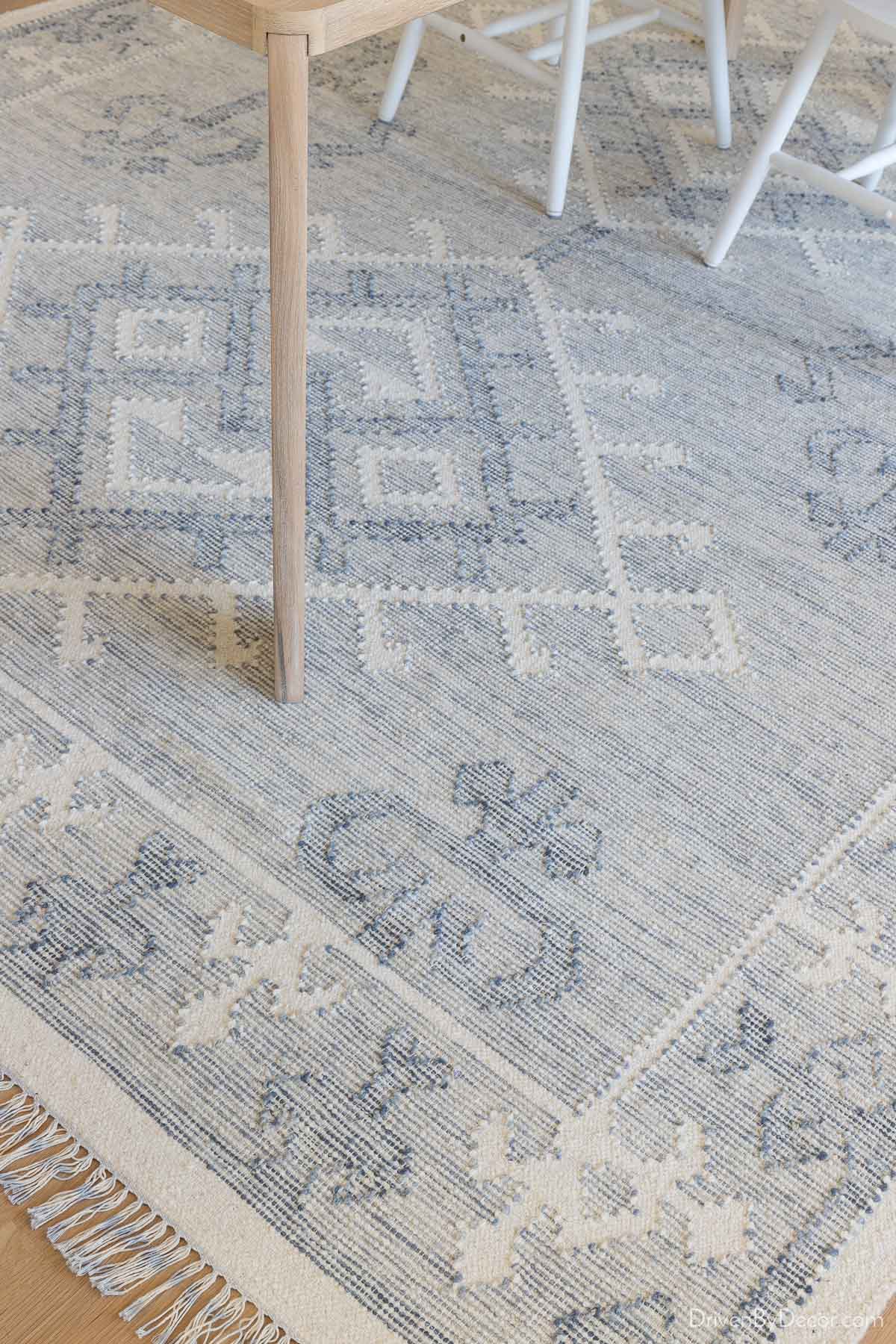 Low pile patterned blue rug in our dining room