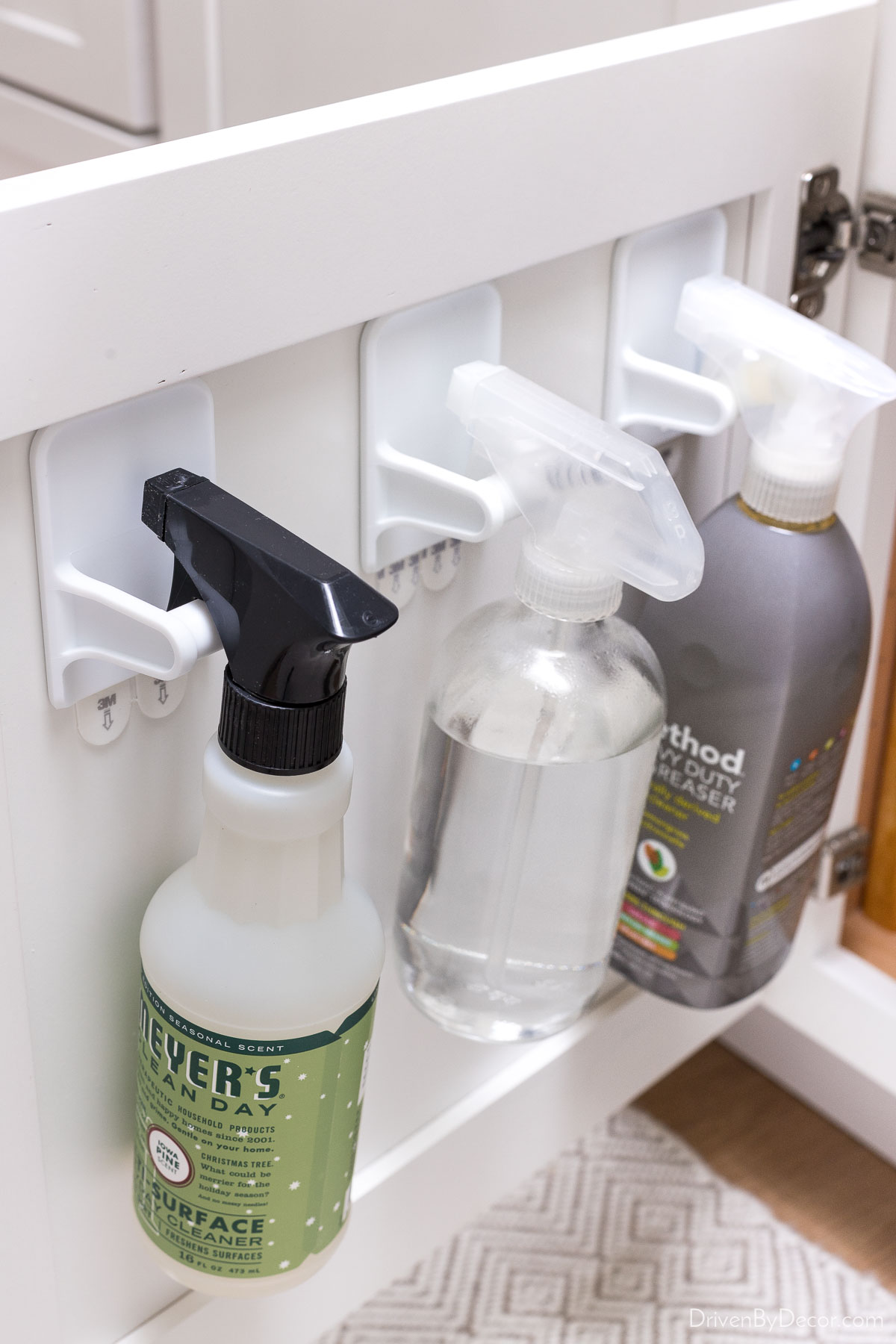 These genius hooks are perfect for holding spray bottles on the back of bathroom cabinet doors