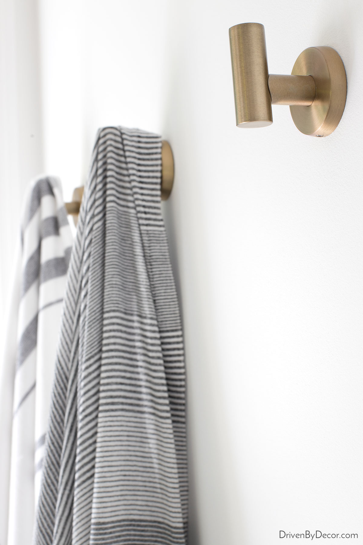 Using towel hooks instead of a towel bar saves space in the bathroom!