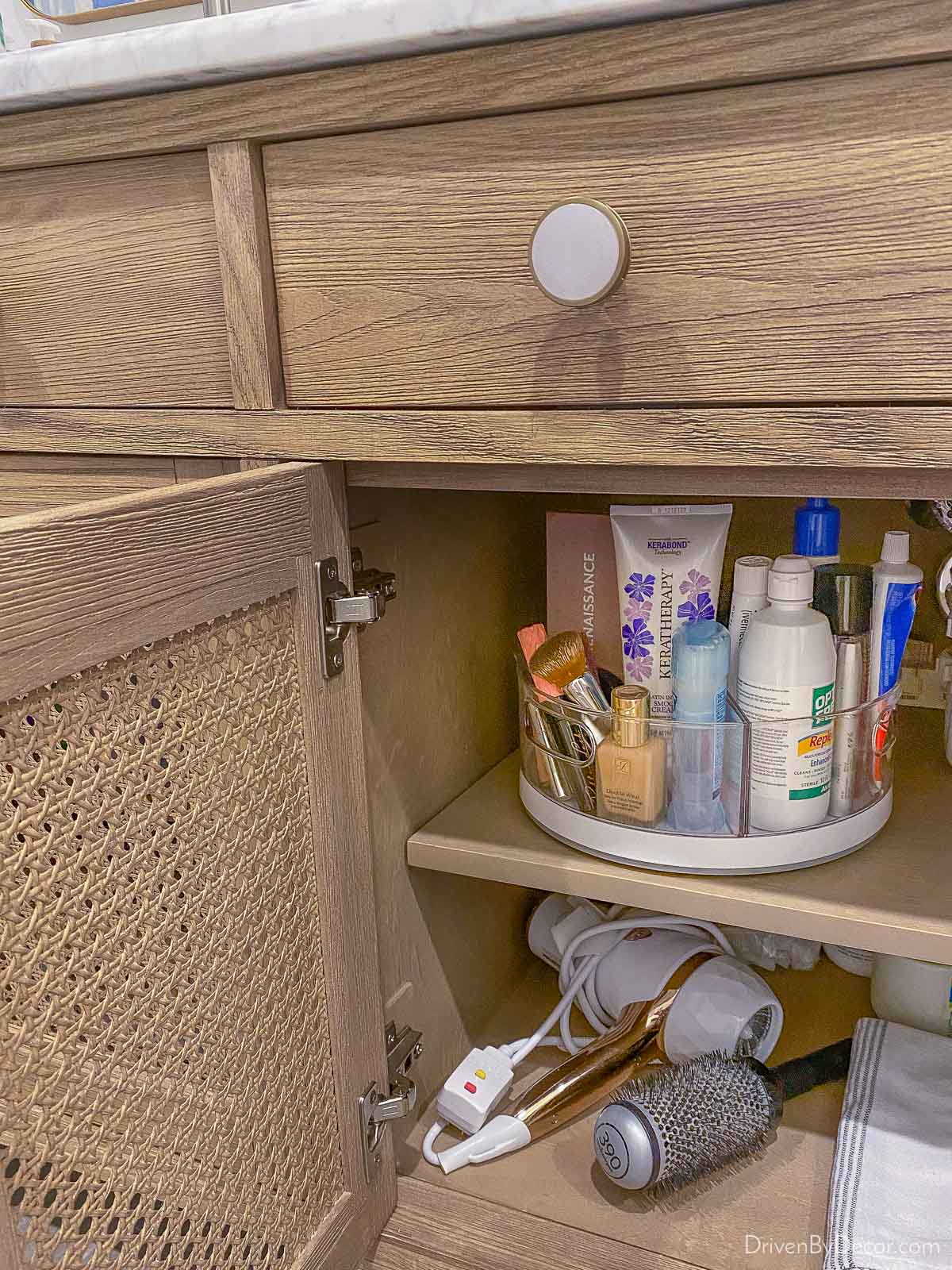 This divided turntable is perfect for storing bathroom toiletries under your bathroom cabinet