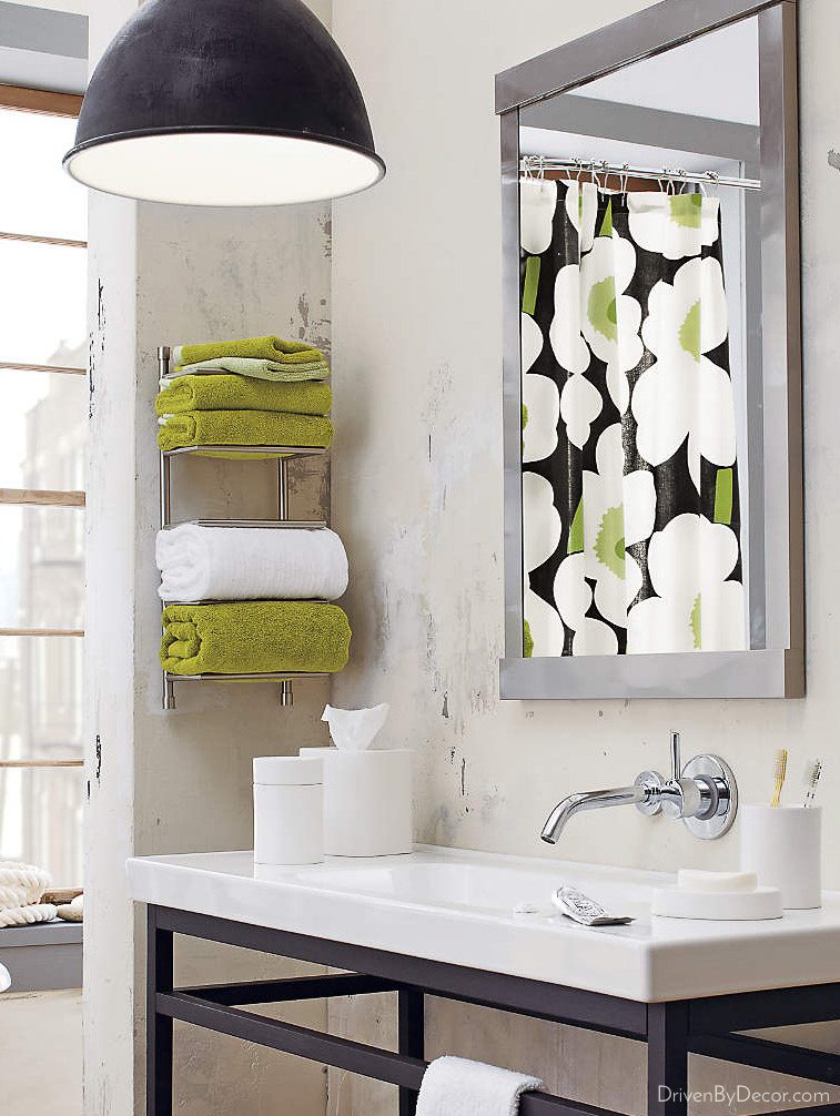 No linen closet for bathroom storage? Store your towels on a wall mounted rack!