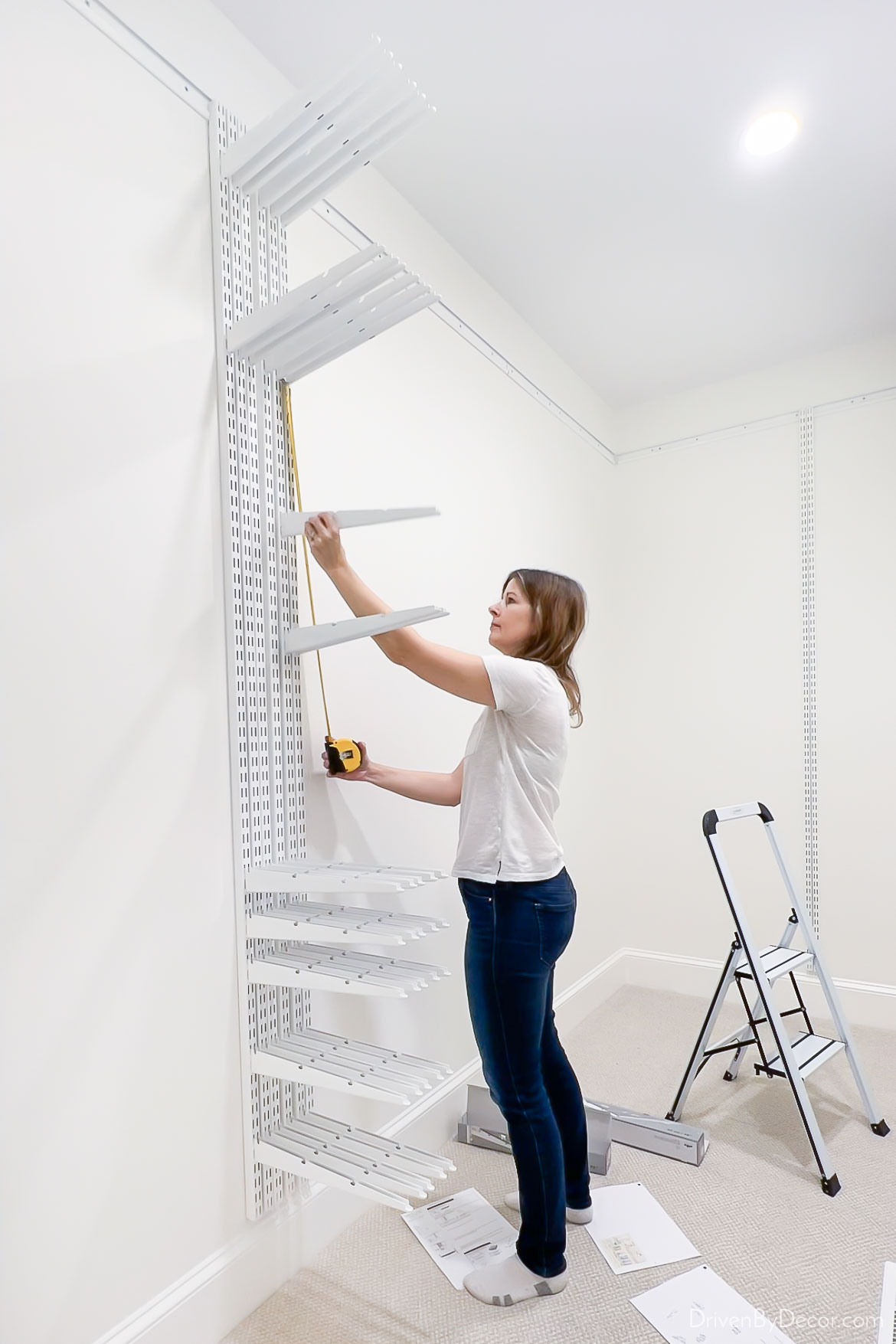 Adding the brackets to the vertical rails of the Elfa closet system