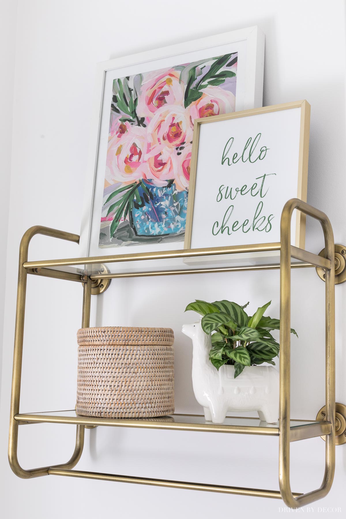 This wall mounted shelving is perfect for storage in a small bathroom