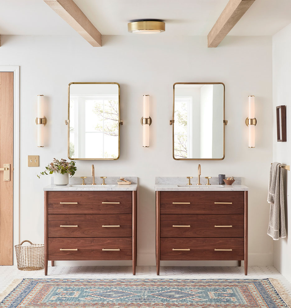 Love this bathroom lighting idea of having three sconces that unit twin vanities!