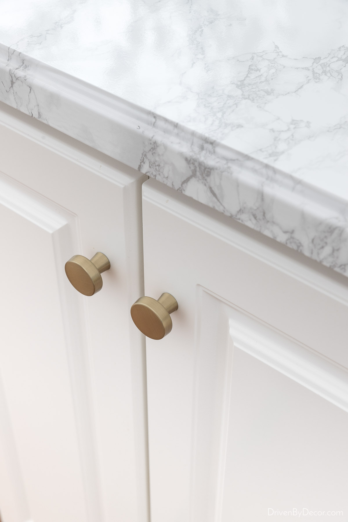 New knobs add an instant update to your kitchen - perfect for a remodel on a budget!