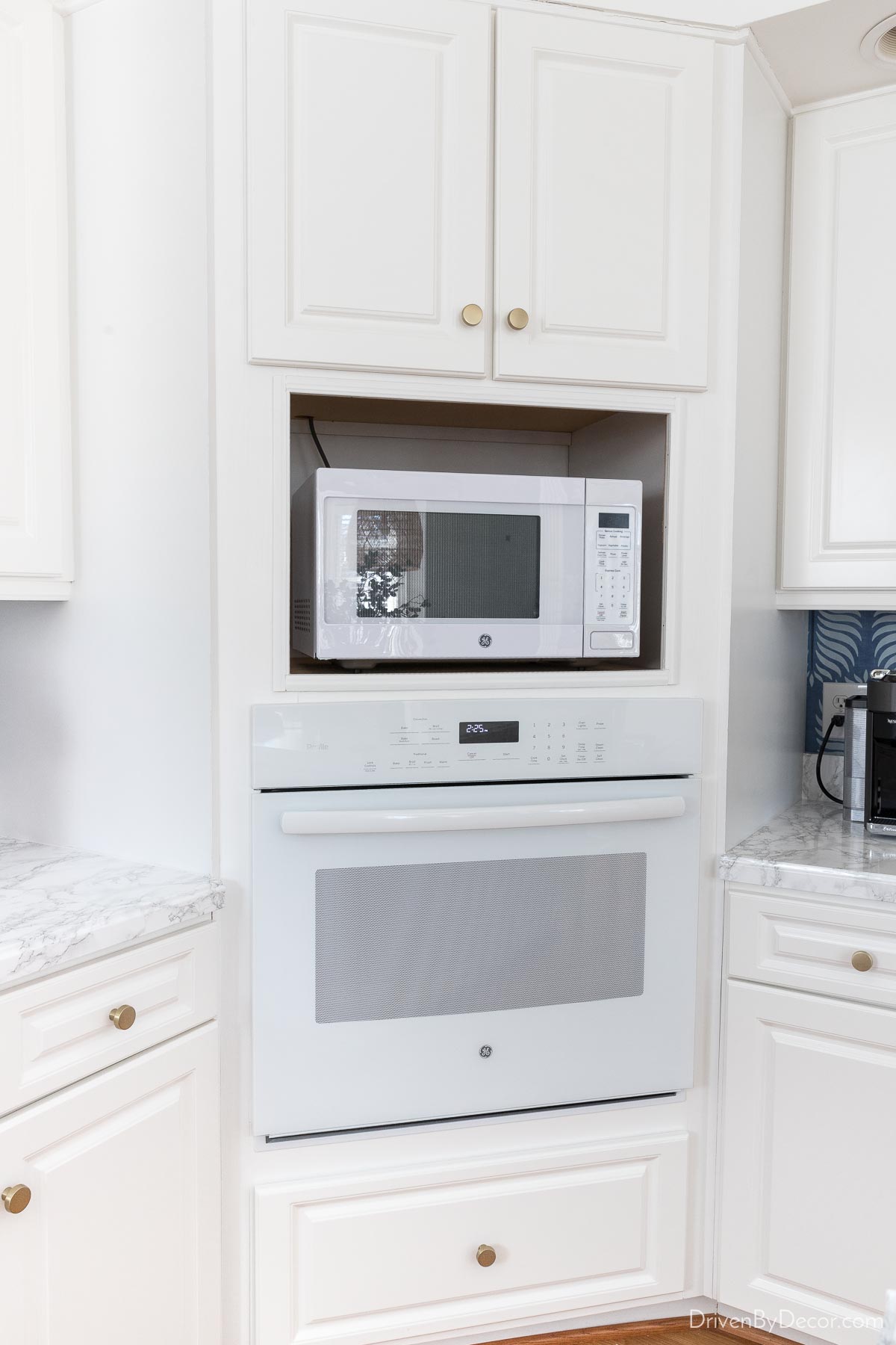 Painting our cabinet trim was a budget friendly part of our kitchen remodel!