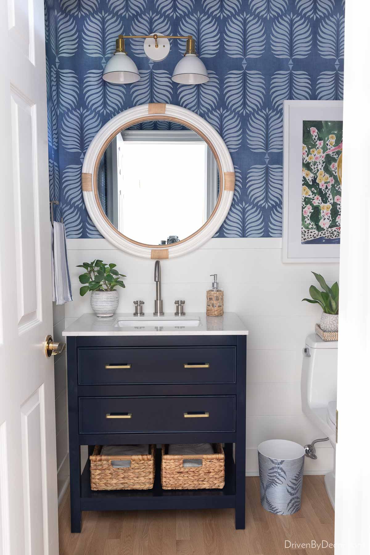 Our remodeled hall bathroom with shiplap walls and blue accents