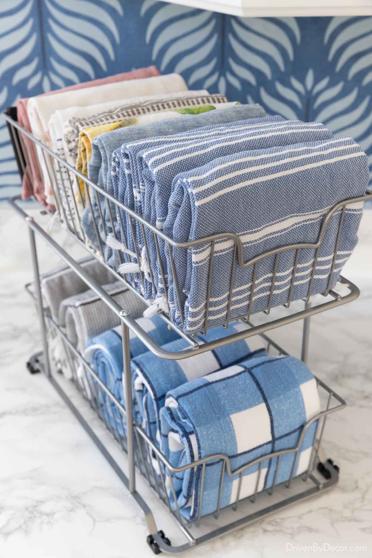 Two tier wire drawers to organize dish towels under the kitchen sink