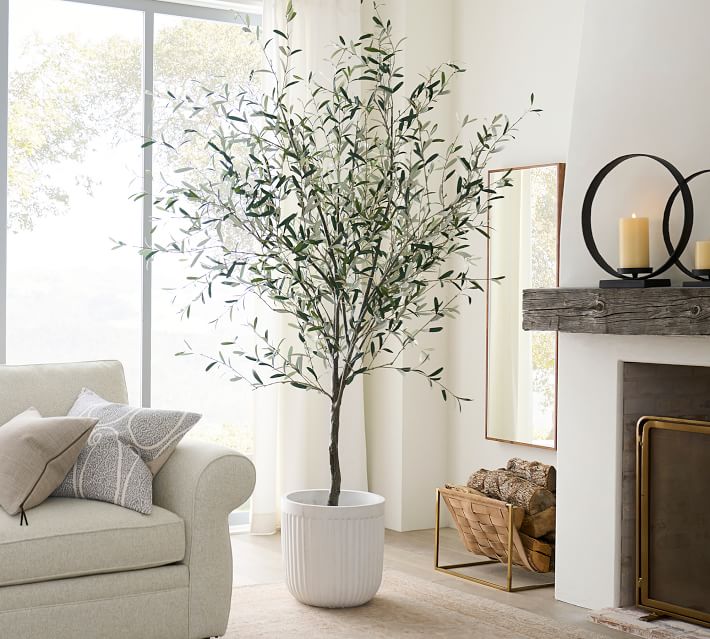 A faux olive tree that would make a great addition to a dining room