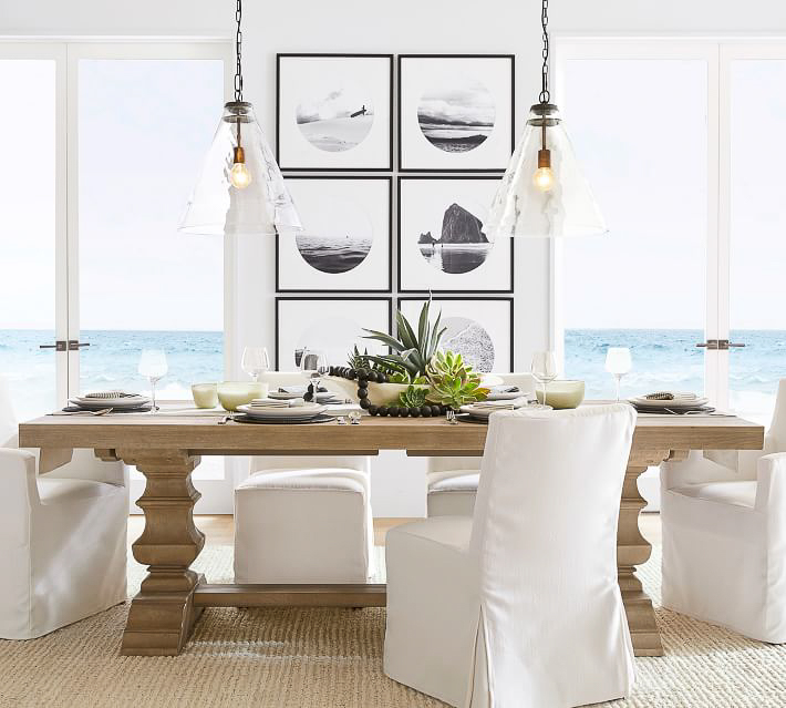 Framed art on wall in a grid pattern as dining room wall decor