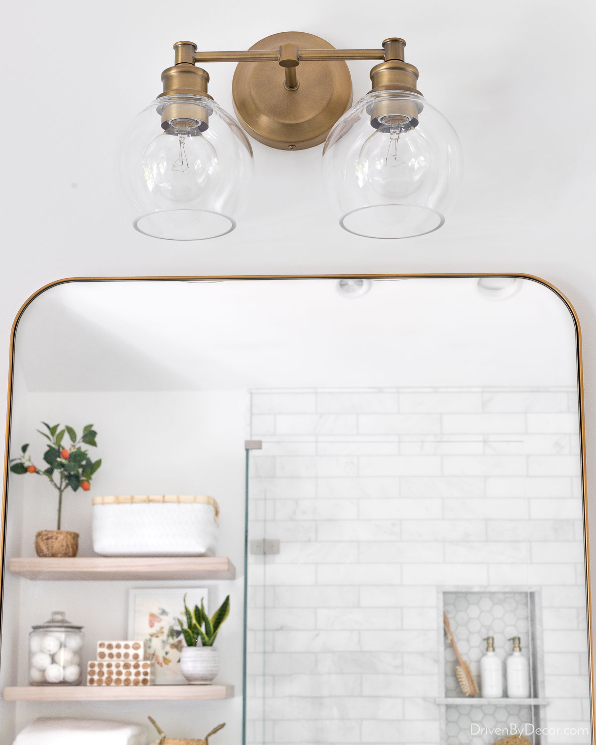 Double vanity light over mirror in bathroom