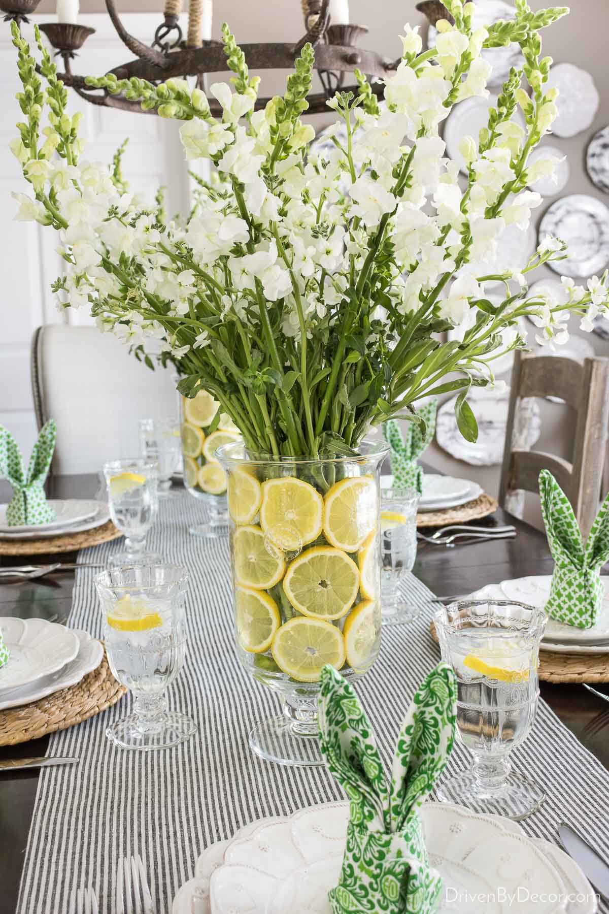 Easter table centerpiece with lemon lined vases