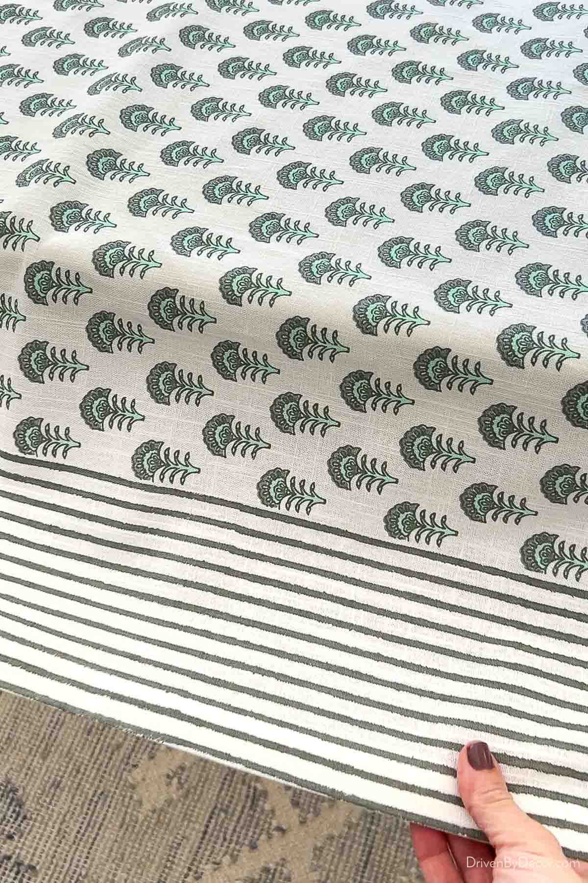Green block print tablecloth on table