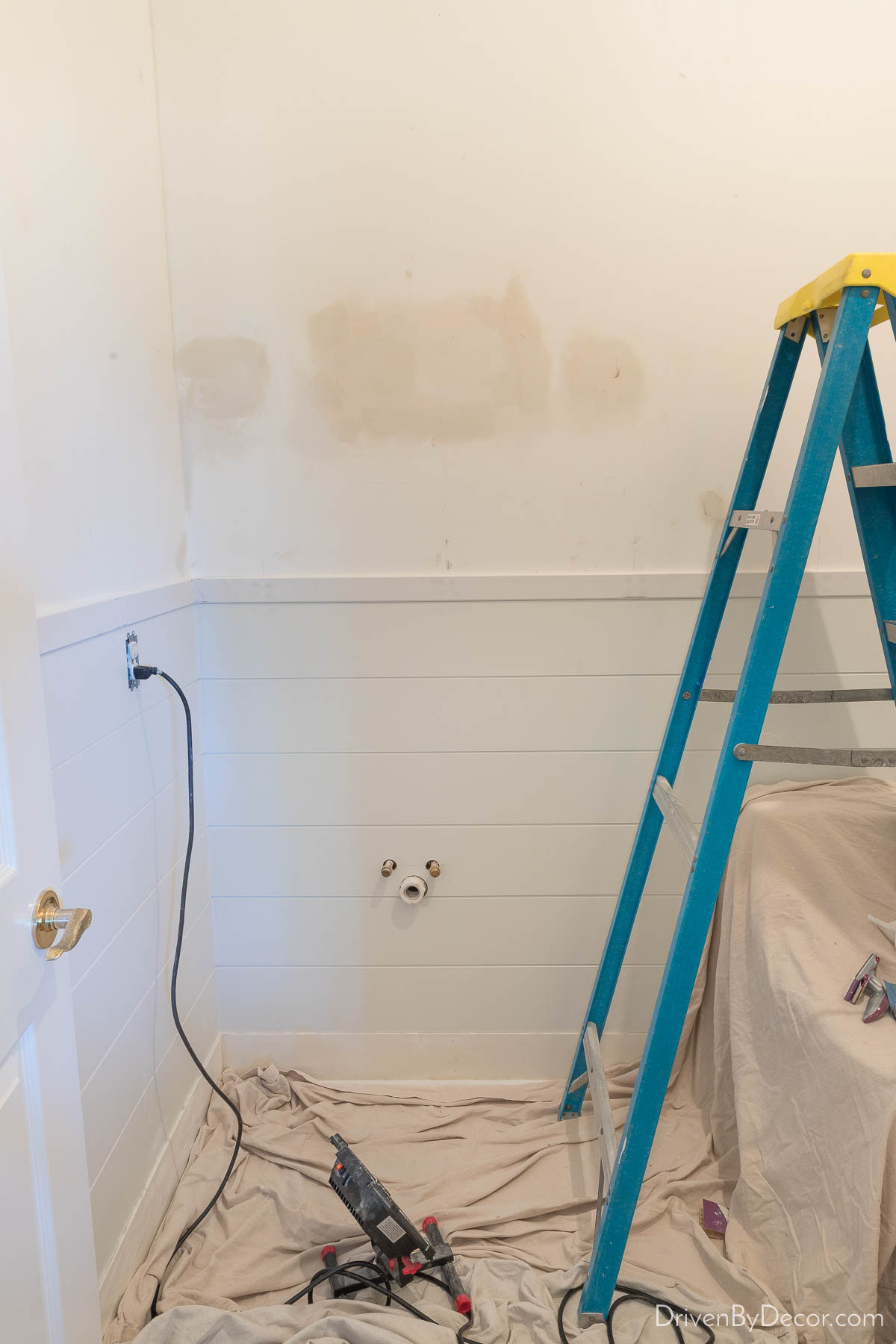 In progress bathroom remodel with shiplap walls