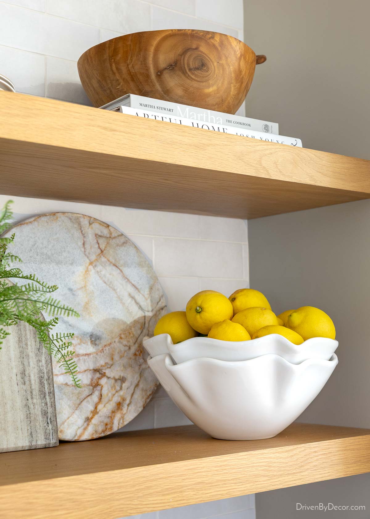 Lemons in a bowl on kitchen shelving