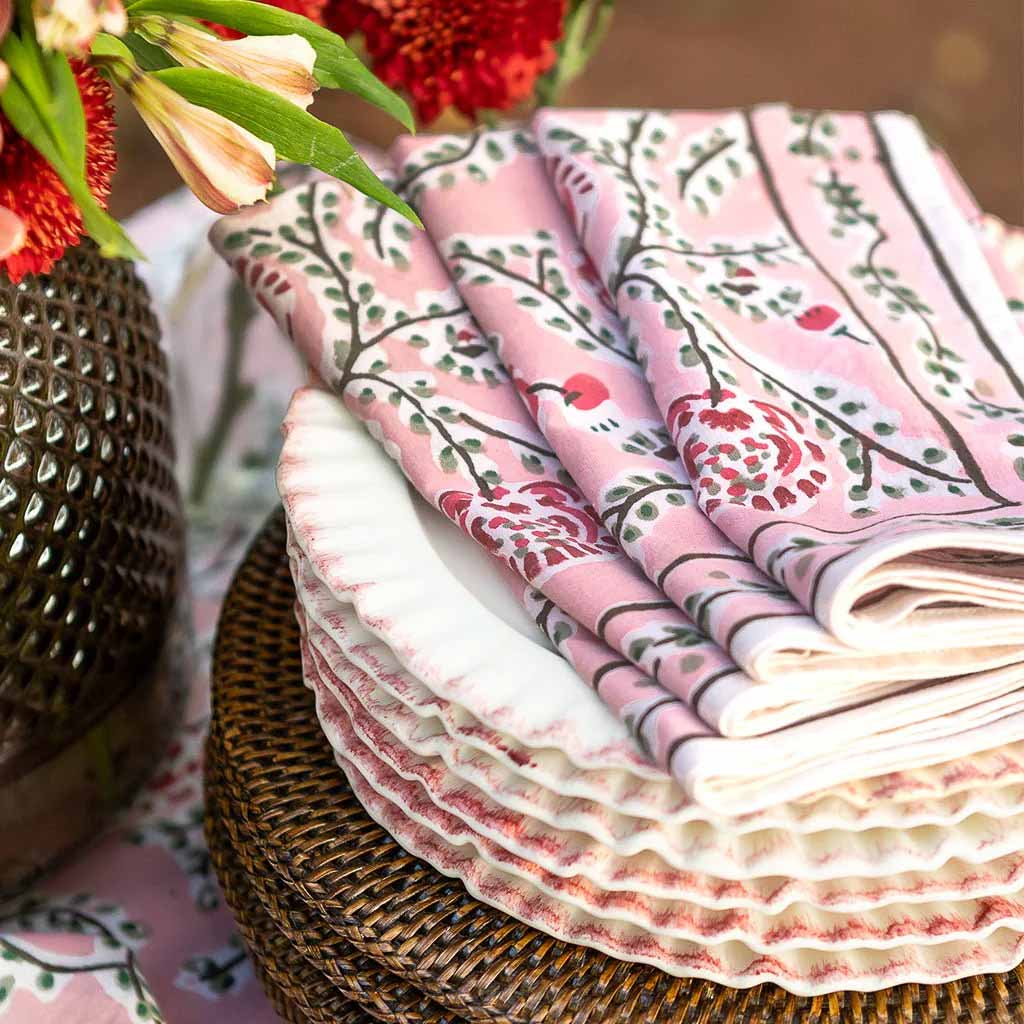 Spring patterned napkins on a stack of plates