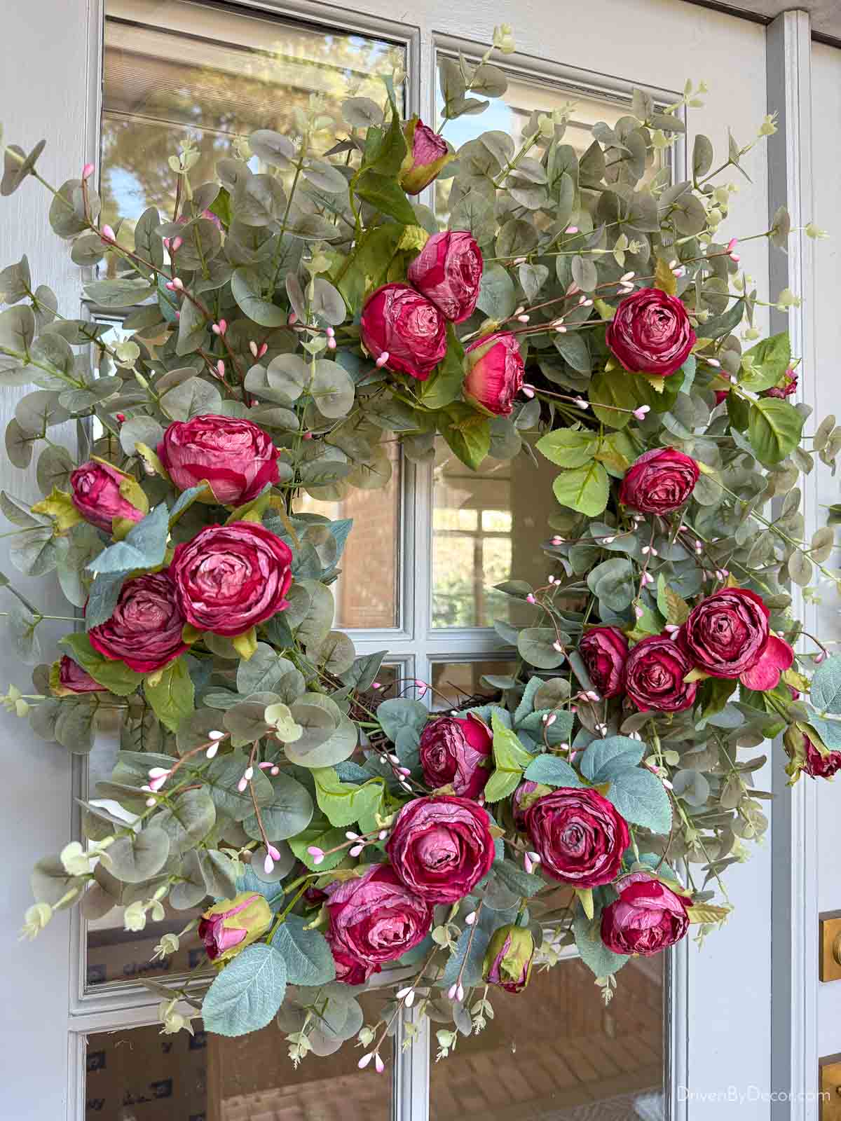 Spring wreath with eucalyptus and red roses