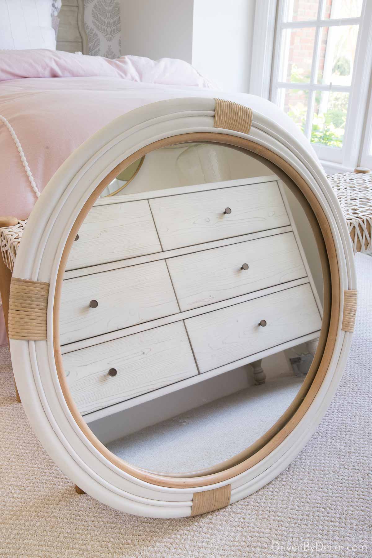 Round white rattan mirror for our hall bathroom